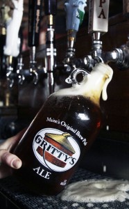 A 64-ounce growler is filled in Maine in 2011. That size is illegal in Florida. (AP photo)