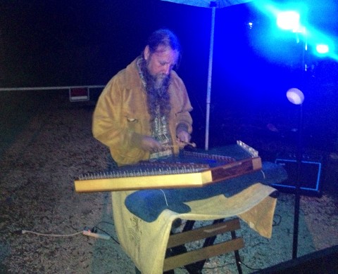Phil Anderson of "Hammered Music" performed outside The Village Mystic at Friday's music festival.
