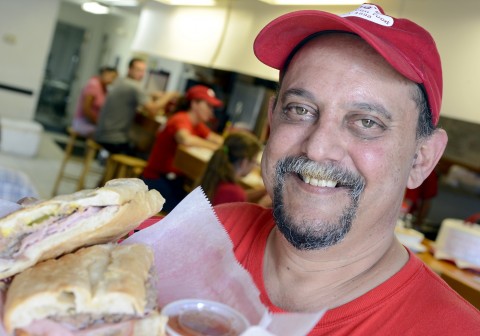 Owner, Jose Baserva with his Cuban Sandwich- Pressed "The Real Thing" Seprano, Ham, Roast Pork, Swiss Cheese, Mustard and Pickles. Jose's Real Cuban Food located at 8799 Cortez Road West in Bradenton. (July 23, 2012 Herald-Tribune Staff Photo by Thomas Bender)