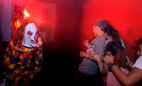Some haunted house patrons say hello to a friendly clown at last year's Frightmares.