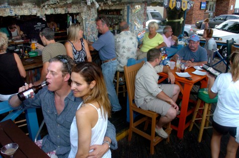 Customers party and listen to music on the deck of the Siesta Key Oyster Bar.  May 3, 2012;  Photo by Carla Varisco-William