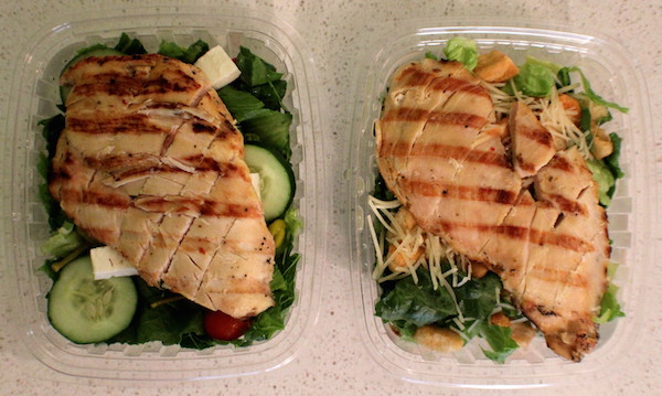 Gyros & Seafood's Greek (left) and Caesar salads (right), both with chicken / COOPER LEVEY-BAKER