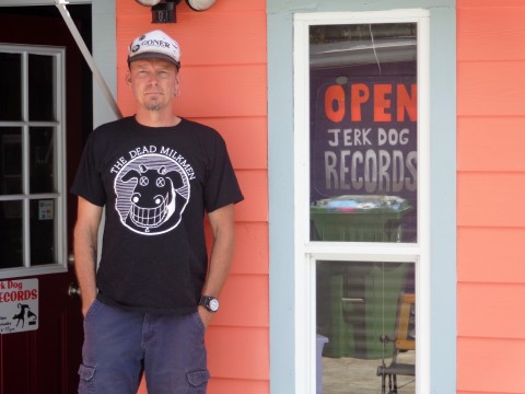 Doug Holland in front of his  music shop Jerk Dog Records in Bradenton's Village of the Arts. COURTESY PHOTO.