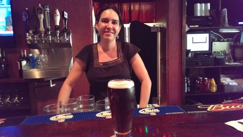 Bartender Michelle Oblek at Shakespeare's English Pub (3550 S. Osprey Ave., Sarasota), with a glass of locally-brewed JDub’s Wee Heavy.