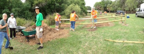 Volunteers and staff install the Colonial Oaks Park community orchard in 2013 / COURTESY AUBREY PHILLIPS