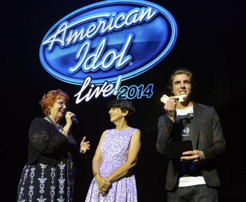 Bradenton singer Sam Woolf, performing with this summer’s “American Idol Live 2014,” is given the key to the city of Sarasota by Sarasota Vice Mayor Susan Chapman, middle, and executive director Mary Bensel at the Van Wezel Performing Arts Hall before the show. (STAFF PHOTO / THOMAS BENDER)