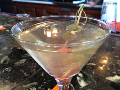 The Savory Martini is Russian Standard Vodka, dry vermouth, "filthy olive juice," hand-stuff blue cheese and garlic olives, and crushed rosemary. STAFF PHOTO/WADE TATANGELO 