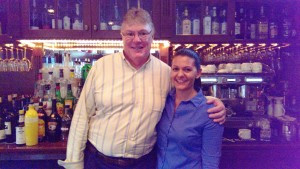 Jean-Pierre Knaggs, owner of Bijou Café, poses with bartender Sarah Firstenberger. 