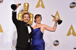 Patrick Osborne,  left, and Kristina Reed hold their awards for best animated short film for their work on "Feast" at the Oscars on Sunday, Feb. 22, 2015, at the Dolby Theatre in Los Angeles. (Photo by Jordan Strauss / Invision / AP)
