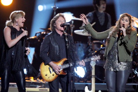 Jennifer Nettles, from left, Tom Johnston, of The Doobie Brothers, and Hillary Scott, of Lady Antebellum, perform onstage at the 48th annual CMA Awards at the Bridgestone Arena on Nov. 5, 2014, in Nashville, Tenn. (Photo by Wade Payne/Invision/AP)