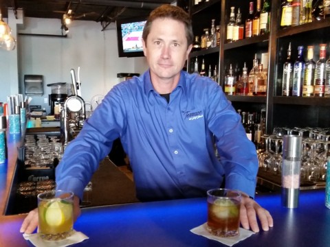 Bartender Jason Hemmerdinger with, from left, the Vernona's Vacation  and 1893 cocktails at The Terrace at Surf Shack on St. Armands Circle. STAFF PHOTO / WADE TATANGELO