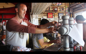 Danny Robinson pours beer at his Ocean City, Maryland, brewery in a scene from the documentary "Blood, Sweat, & Beer." (Provided by Alexis Irvin)  