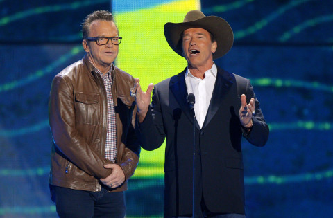 Tom Arnold, left, and Arnold Schwarzenegger present the award for video of the year at the CMT Music Awards at Bridgestone Arena on Wednesday, June 10, 2015, in Nashville, Tenn. (Photo by Wade Payne/Invision/AP)