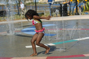 Zykeria Liafortune, 5, of Bradenton enjoys the splash pad fountain at Riverwalk. HT ARCHIVES