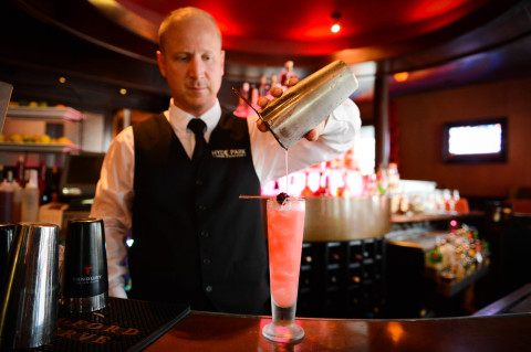 James Durrance makes a Blackberry Bulleit at Hyde Park Prime Steakhouse in downtown Sarasota. Who knew it would turn out bright pink? STAFF PHOTO / RACHEL S. O’HARA 