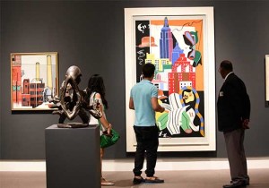 Visitors look at the art on exhibit at the North Museum of Art in Palm Beach County.