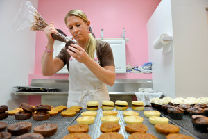 Becky Schultes, owner of Heavenly Cupcakes, decorates whoopie pies and cupcakes at her Gulf Gate store at 6538 Gateway Ave. in Sarasota, Fla.   (Oct. 17, 2012; Herald-Tribune staff photo by Mike Lang)