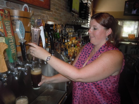 Fiona Farrell, director of operations at Gecko's Hospitality Group, pours a pint of Blue Baltic at the Gecko's on Hillview Street in Sarasota today. STAFF PHOTO / ALAN SHAW