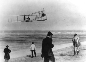 In this undated file photo, Orville and Wilbur Wright test their airplane on a beach.  (AP Photo/File)