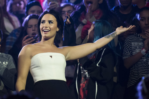Demi Lovato speaks at We Day on Thursday, Oct. 1, 2015, in Toronto. (Photo by Arthur Mola/InvisionAP)