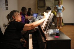 Musical Director Michelle Kasanofsky works on her score during a rehearsal for "Hair" directed by Ben Vereen at Venice Theatre. RENEE MCVETY PHOTO/PROVIDED BY VENICE THEATRE