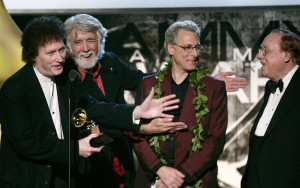 The Nitty Gritty Dirt Band react after accepting their award for best country instrumental performance for "Earl's Breakdown" at the 47th Annual Grammy Awards on Sunday, Feb. 13, 2005, in Los Angeles. Randy Scruggs is at left and Earl Scruggs is second from left. (AP Photo/Kevork Djansezian)