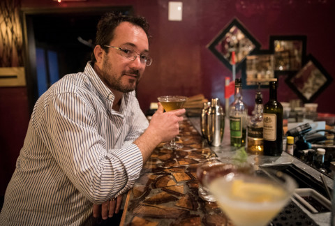 Wade Tatangelo poses for a photo in between sips of of his Tipperary cocktail at Pangea Alchemy Lab. STAFF PHOTO / NICK ADAMS