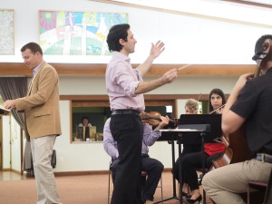 George Nickson, center, leads ensemblenewSRQ in a rehearsal before the upcoming concerts. COURTESY PHOTO