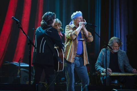 Jimmie Fadden, center, plays harmonica with Jeff Hanna, left, and John McEuen, right, during the Nitty Gritty Dirt Band's 50-year anniversary special recorded at the Ryman Auditorium in Nashville. (Photo provided / WEDU)