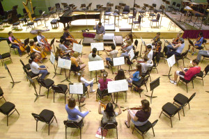 Ken Bowermeister leading the Florida West Coast Symphony Youth Orchestra in 2001. / Photo by Michael Barrientos/digital image)-- Symphonic Strings conductor Ken Bowermeister leads students during rehearsal for the Florida West Coast Symphony Youth Orchestra Program Showcase Concert at the Van Wezel Theater.