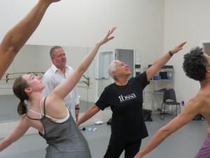 Choreographer Elizabeth Bergmann works with dancers as Una Voce's musical director, Joseph Caulkins, looks on. / Staff photo by Carrie Seidman
