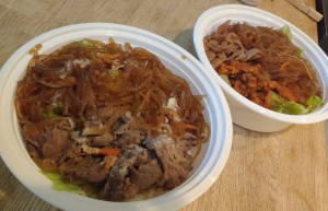 Bowls from Bul Go Gi, with beef in front and chicken/pork in back. (STAFF PHOTO/BRIAN RIES)