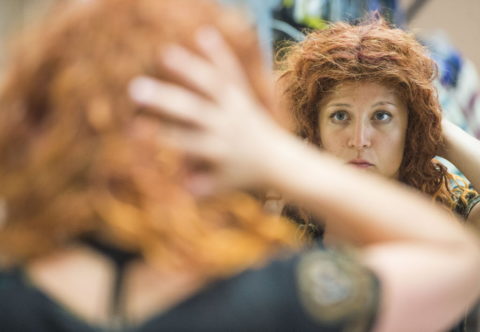 Chloe Mantrippe adjusts her wig before a matinee of "Hetty Feather" in which she plays the title role at Asolo Repertory Theatre. STAFF PHOTO / NICK ADAMS