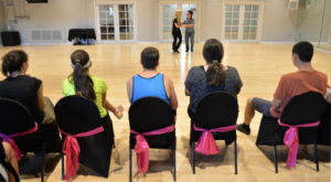 Parents and students watch as Michael Devita and instructor Sarah Haworth practice their swing routine in preparation for a performance at the Millennium Dancesport Championship in Orlando, one of the biggest ballroom competitions in the country. STAFF PHOTO / MIKE LANG