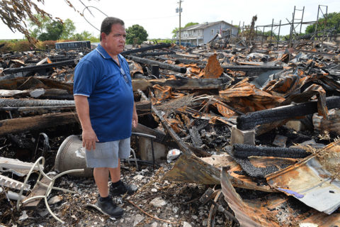 J.R. Garraus stands in the ruins of the storage unit he rented behind his J.R's Old Packinghouse Cafe, 987 S. Packinghouse Road, Sarasota, on June 20, 2016. A fire destroyed several buildings in the 900 block of Packinghouse Road in Sarasota County on June 17 and damaged J.R's Old Packinghouse Cafe. STAFF PHOTO / MIKE LANG