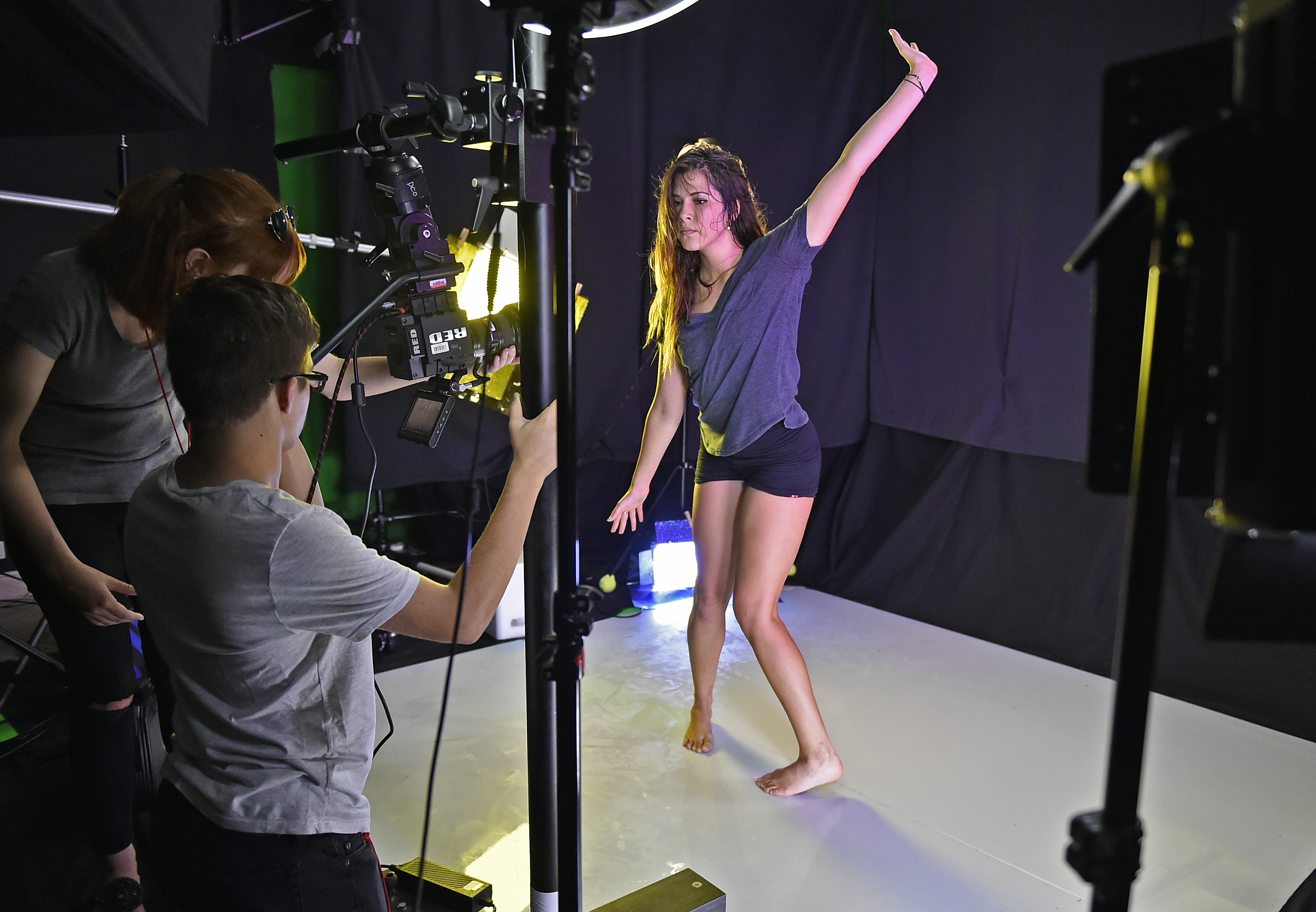 Lens operator, Ellie Zayas, 17, far left, and cinematographer, Max Mezrah, 17, compose a close-up scene with contemporary dancer, Danielle Miller, 20, of Brandon, right, during a recent filming for a pre-college 4D computer animation class at Ringling College of Art and Design. (July 7, 2016; STAFF PHOTO / THOMAS BENDER)