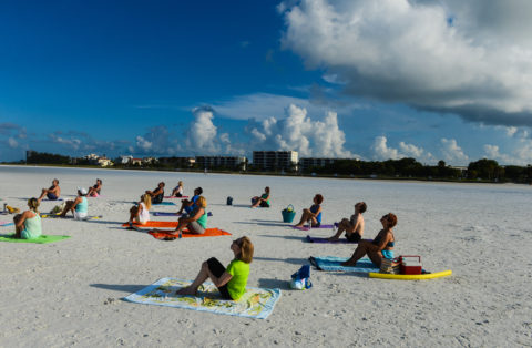 Morning yoga class at Siesta Beach. H-T ARCHIVE