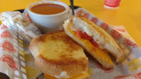 Grilled cheese with tomatoes and garlic and a bowl of tomato soup at Tom+Chee. (STAFF PHOTO/BRIAN RIES)