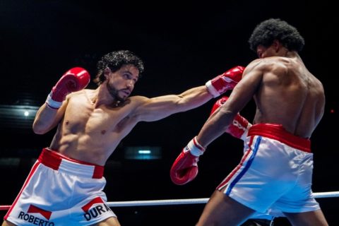 This image released by The Weinstein Company shows Edgar Ramirez, left, and Usher Raymond in a scene from, "Hands of Stone." (Rico Torres/The Weinstein Company via AP) 