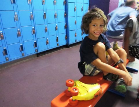 Emmanuel puts his skates on in the Stardust Skate Center change room before getting on the rink. PHOTOS BY KIM DOLEATTO