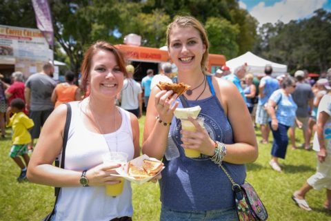 Julie Gauntt and Hannah Stoneman enjoy grilled cheese sandwiches and lemonade at the Manasota Grilled Cheese Festival Saturday, August 20 at Sutton Park in Palmetto. STAFF PHOTO / RACHEL S. O’HARA