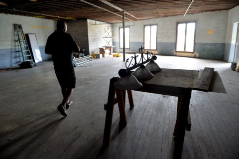 Tony Tannus walks through the empty third floor of the historic Charles Ringling Building. Business partners,Tony and Marie Tannus, and Alex Hagush have leased the building and are currently renovating it. They plan to open Sarasota Sky Bar & Club in early September. Herald-Tribune staff photo / Mike Lang